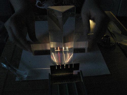Photo of the intriguing reflection effects when a right-angle prism is explored with a three-light source.