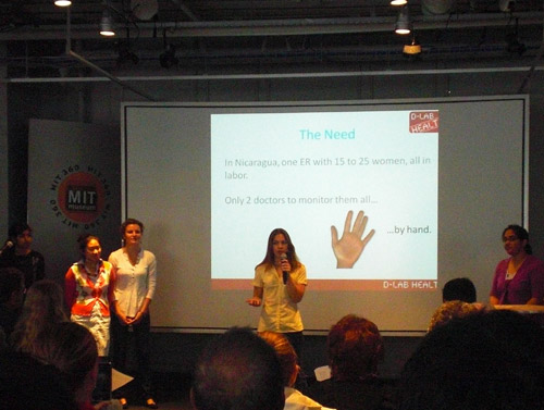 A photo showing the team presenting to the audience.