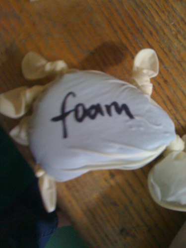 Photo of a disposable glove filled with foam.