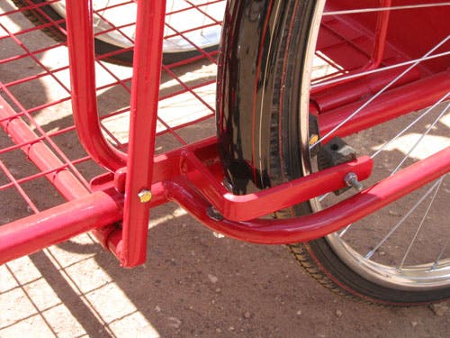 Photo showing brake shoes near the rear wheel rim.