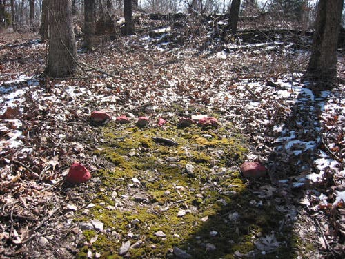 Weathered mine with markers. 