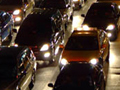 Photo of many cars at night stuck on a highway in Bangkok.
