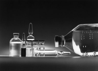 Glass vials and bottles containing chemotherapy drugs.