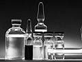 Glass vials and bottles containing chemotherapy drugs.