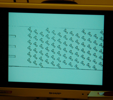 Detailed features of a wafer magnified on video microscope screen.