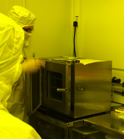 A cube-shaped metal device with a door on the front.