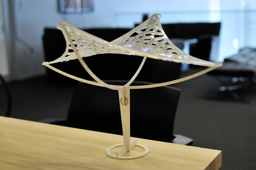 Photo of the assembled lamp on a table, side view.