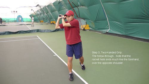 The left hand stays on the racket all the way through the stroke, pulling the racket back over the right shoulder.