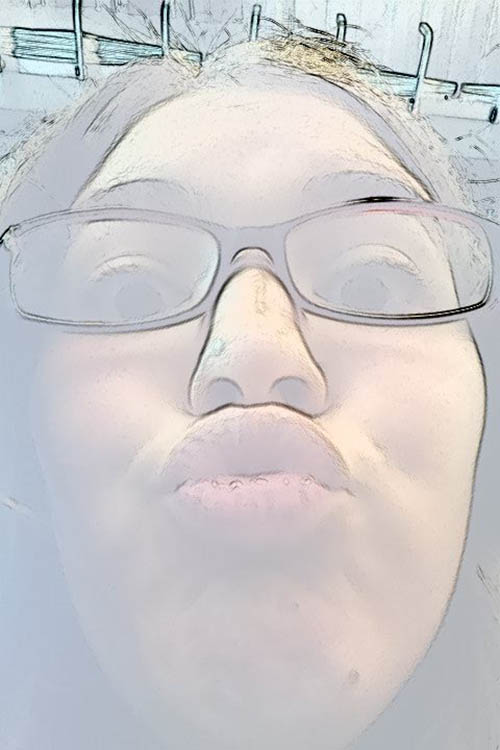 A photo of a girl with glasses.