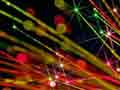 Photograph of the ends of fiber optic fibers lit by a red LED.
