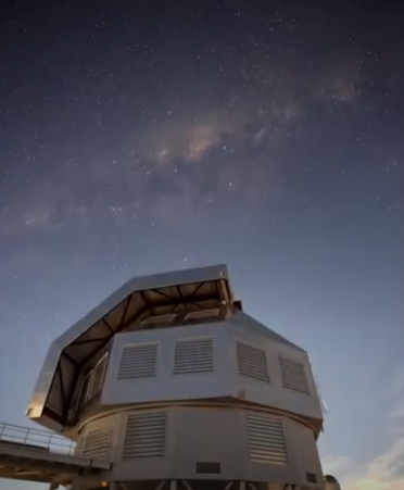 The Milky Way poised above an observatory.