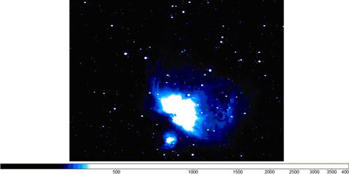 An image of Orion, with a black background and a burst of blue and white in the center. 