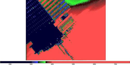 An image of the Prudential Center upside down in red and green. 