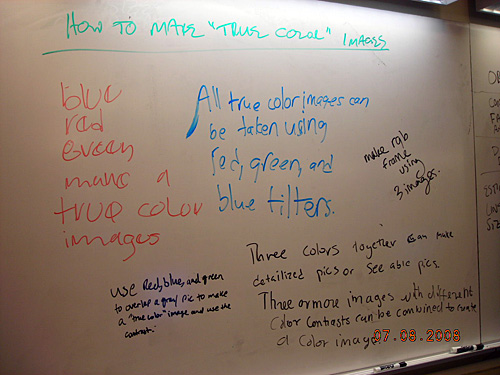 Handwritten notes on a whiteboard about how to make "true color" images. 