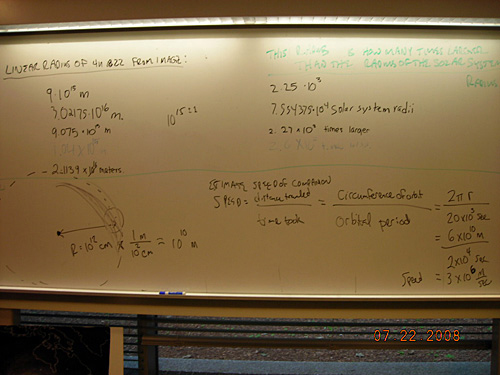 A photo of notes on a whiteboard that show calculations about linear diameter of blocking material. 