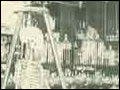 An old photograph from a biology lab at MIT in the 1800s. There is a skeleton in the foreground.