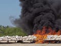 The U.S. Drug Enforcement Administration sets seized cocaine ablaze.