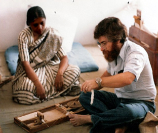 Michael Fischer learns to use a Gandhian spinning wheel of self-reliance.