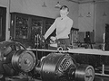 A black and white photograph of Jim Tillma in the electrical engineering laboratory. University of Nebraska, Lincoln.